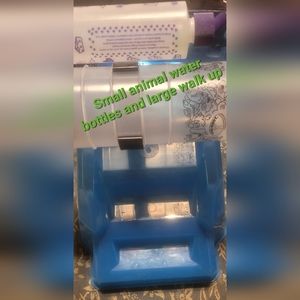 3 small animal water bottles and 1 large walk up barn